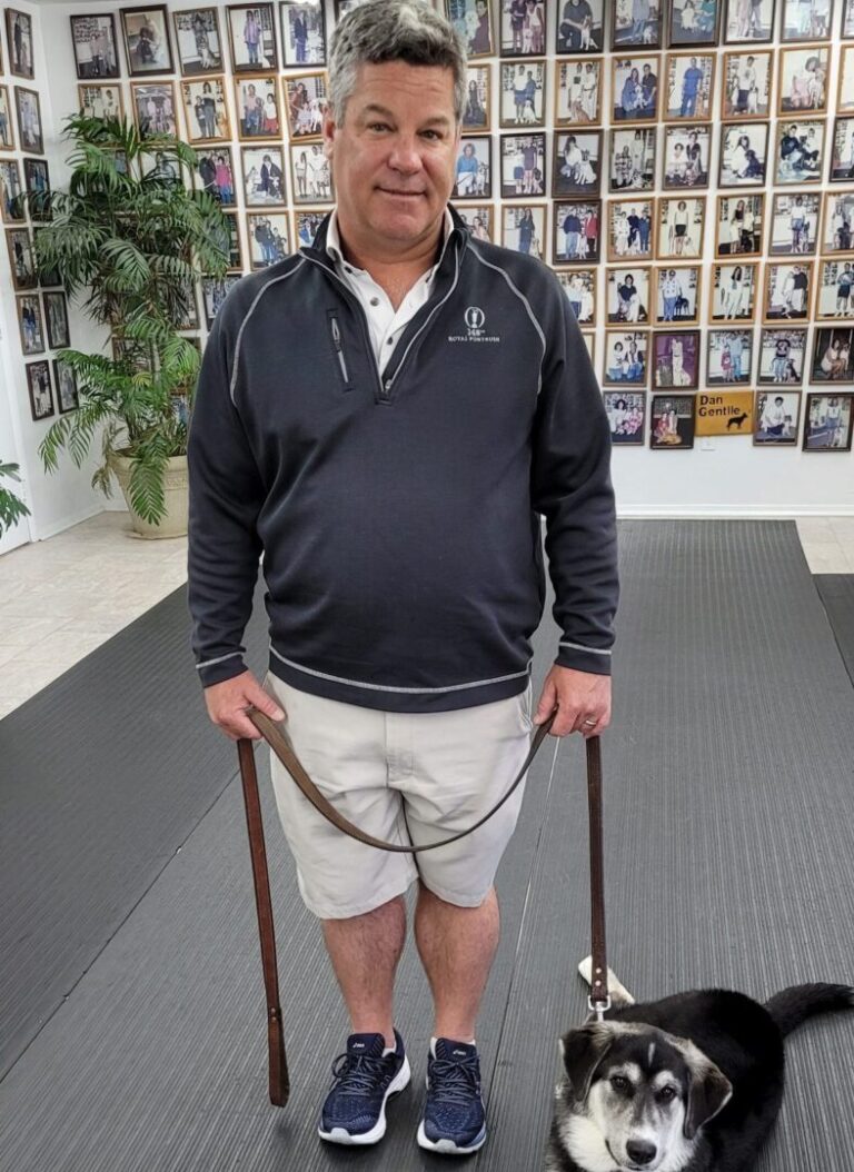 a man walking a dog on a leash
