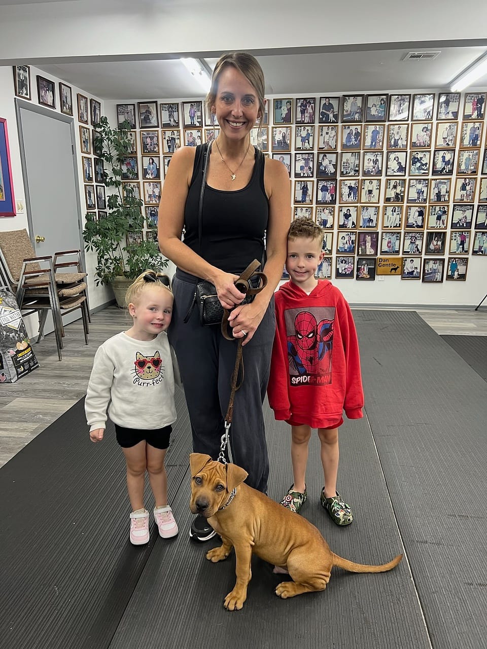 Family picking up their trained dog